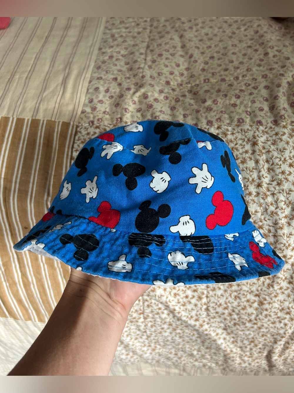 Infant Disney blue bucket hat with red black and white designs